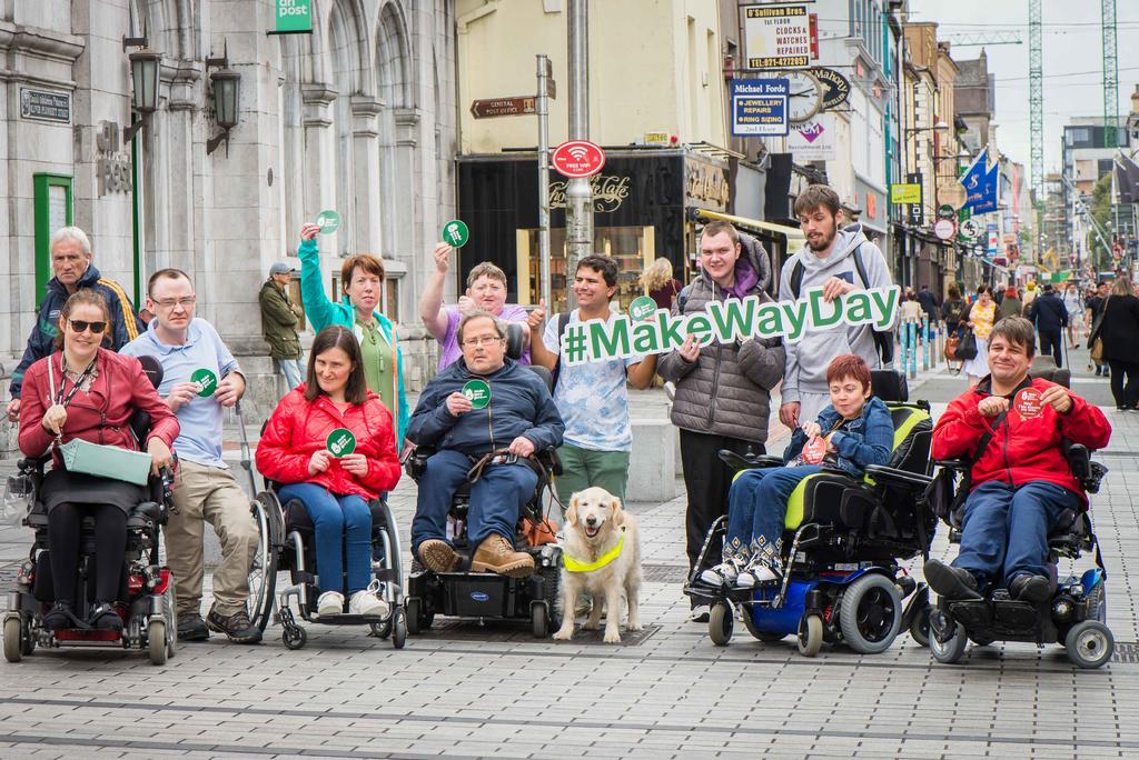 Group photo of people with disabilites promoting MakeWayDay with a sign